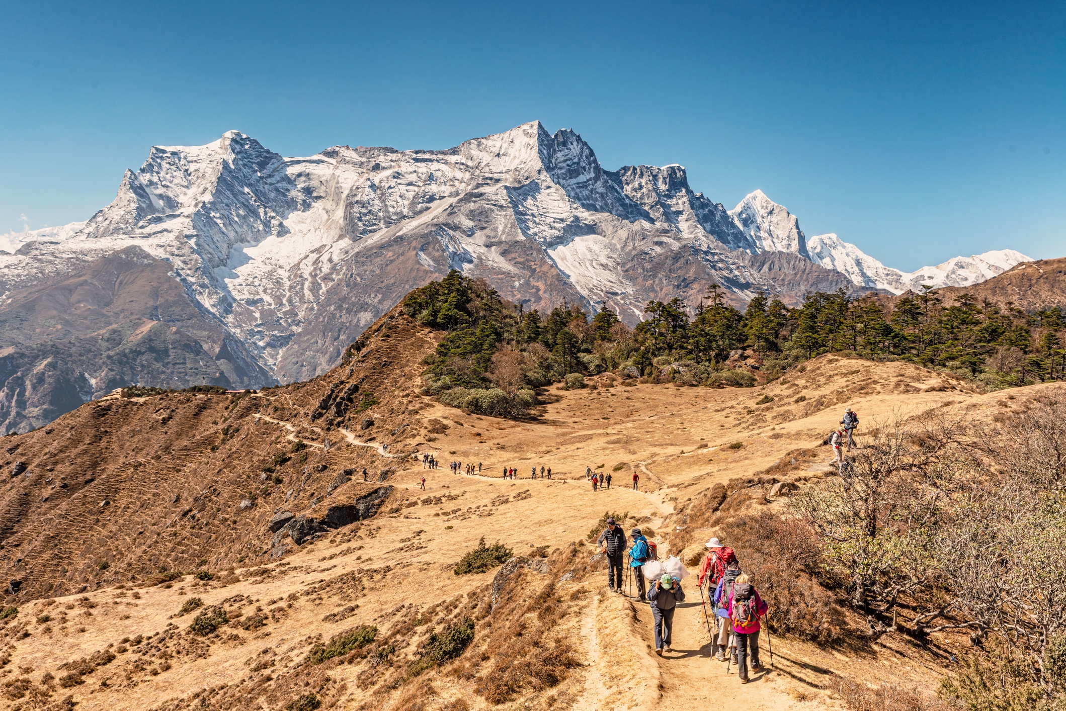 Tourists just outside of Namche Bazaar on way to Everest View Hotel, Kongde Ri peak in background