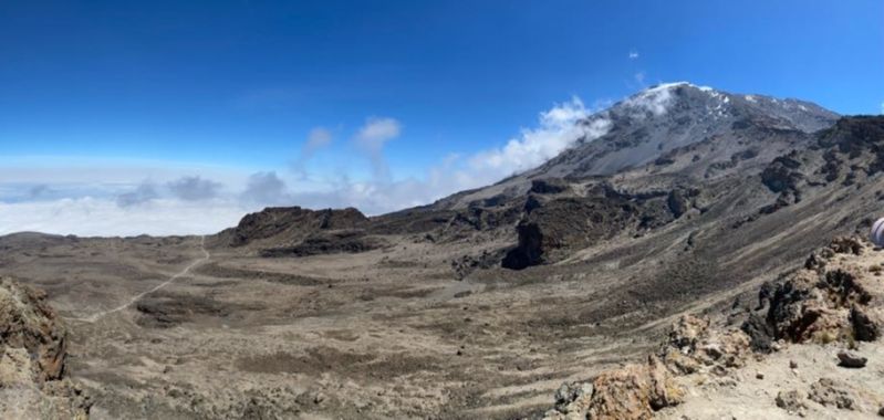 Panorama of trail leading to Barafu Camp with Uhuru Peak in view. Kilimanjaro.