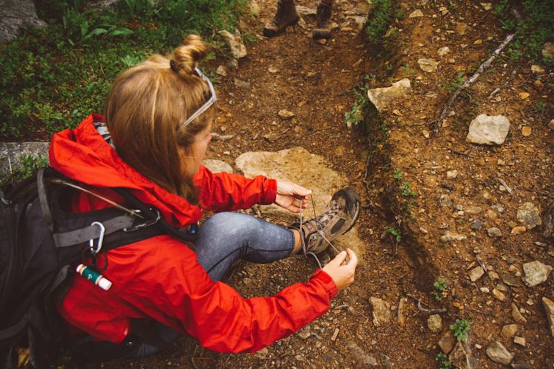 woman tying her hiking boots