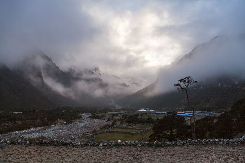 Misty view of Thame village in Thamichho valley, EBC and Three Passes trek route, Nepal