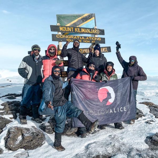 Kilimanjaro group pic summit Uhuru Peak FA flag