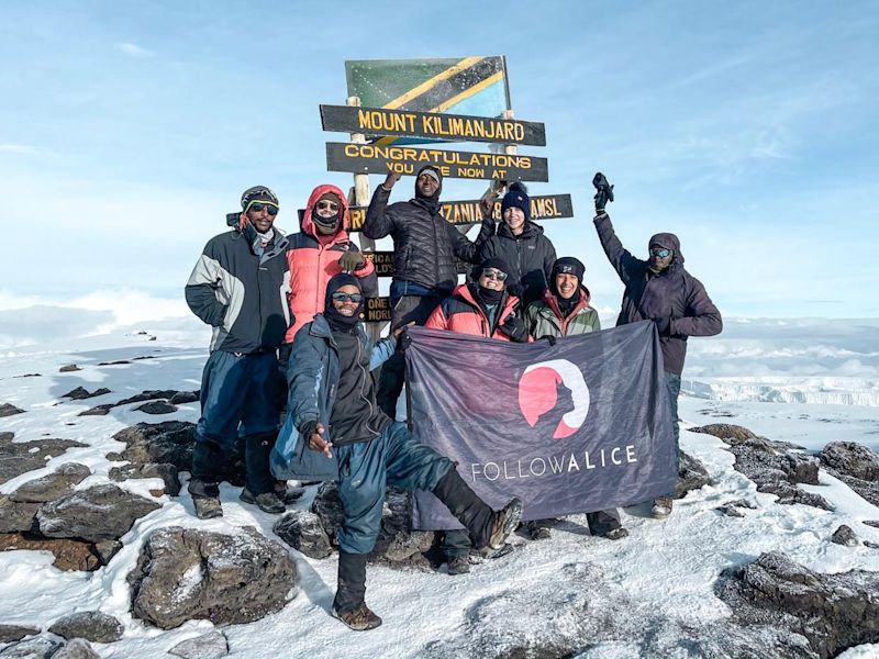 Kilimanjaro group pic summit Uhuru Peak FA flag