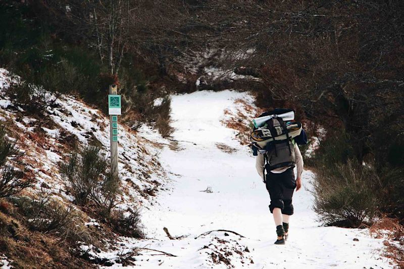 Man trekking in snow