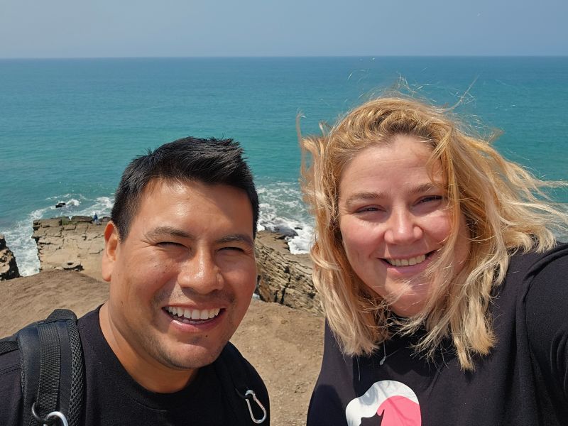 Man and woman selfie by sea in Lima, Peru