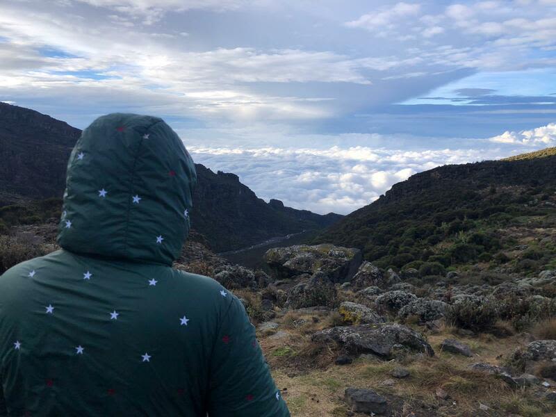 Arwa looking over clouds at Shira 2 Camp on Kilimanjaro