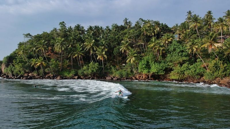 Sri Lanka beach and surfer on adventure holiday