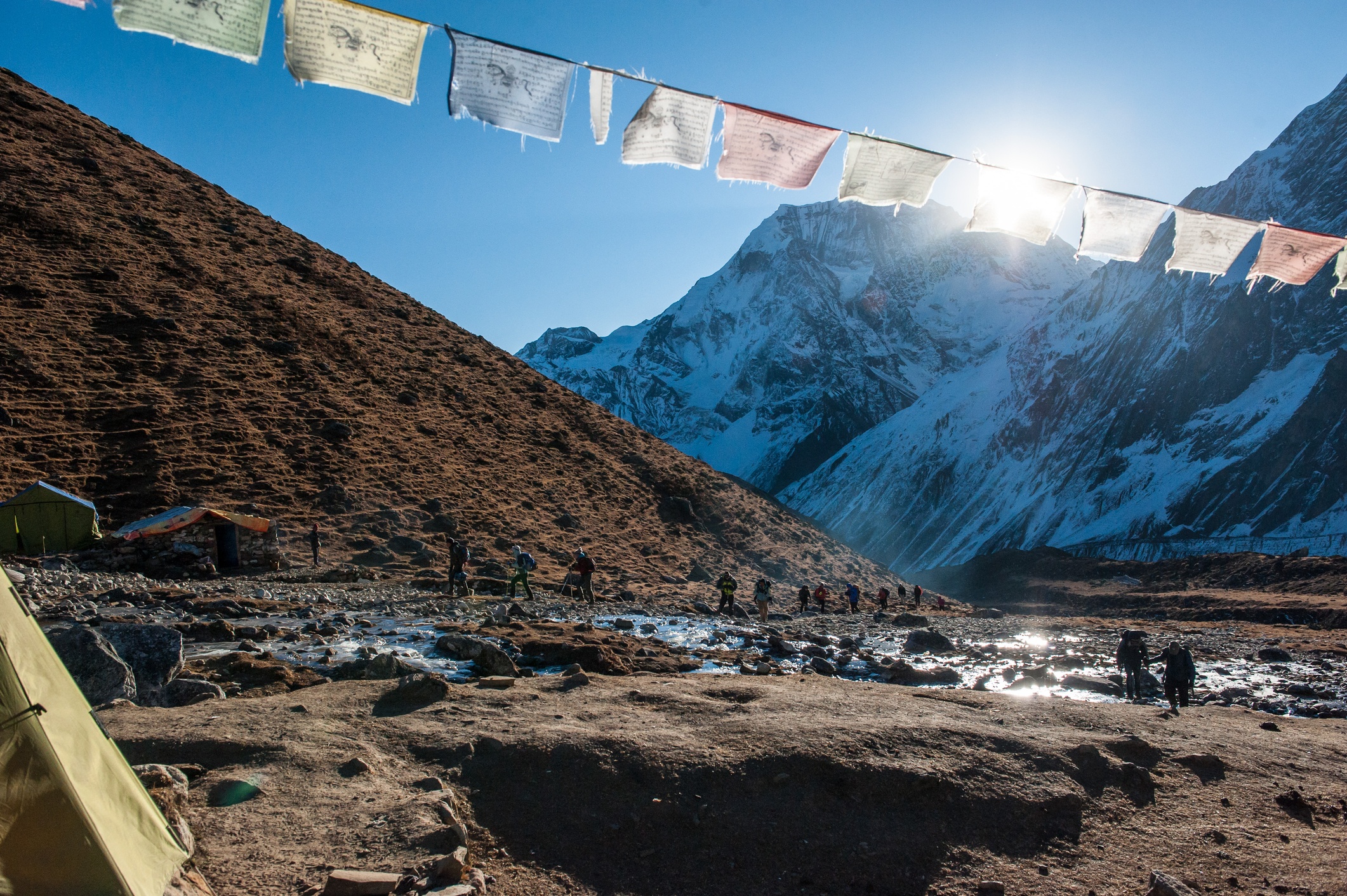 A group of trekkers in Dharamsala before walking the pass on Manaslu circuit with view of Mount Manaslu range 8 156 meters. Nepal. Himalayas