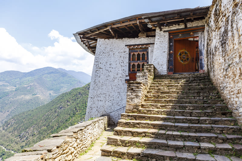 Colourful painted wooden entrance door of Lhuentse Dzong Monastery in Bhutan