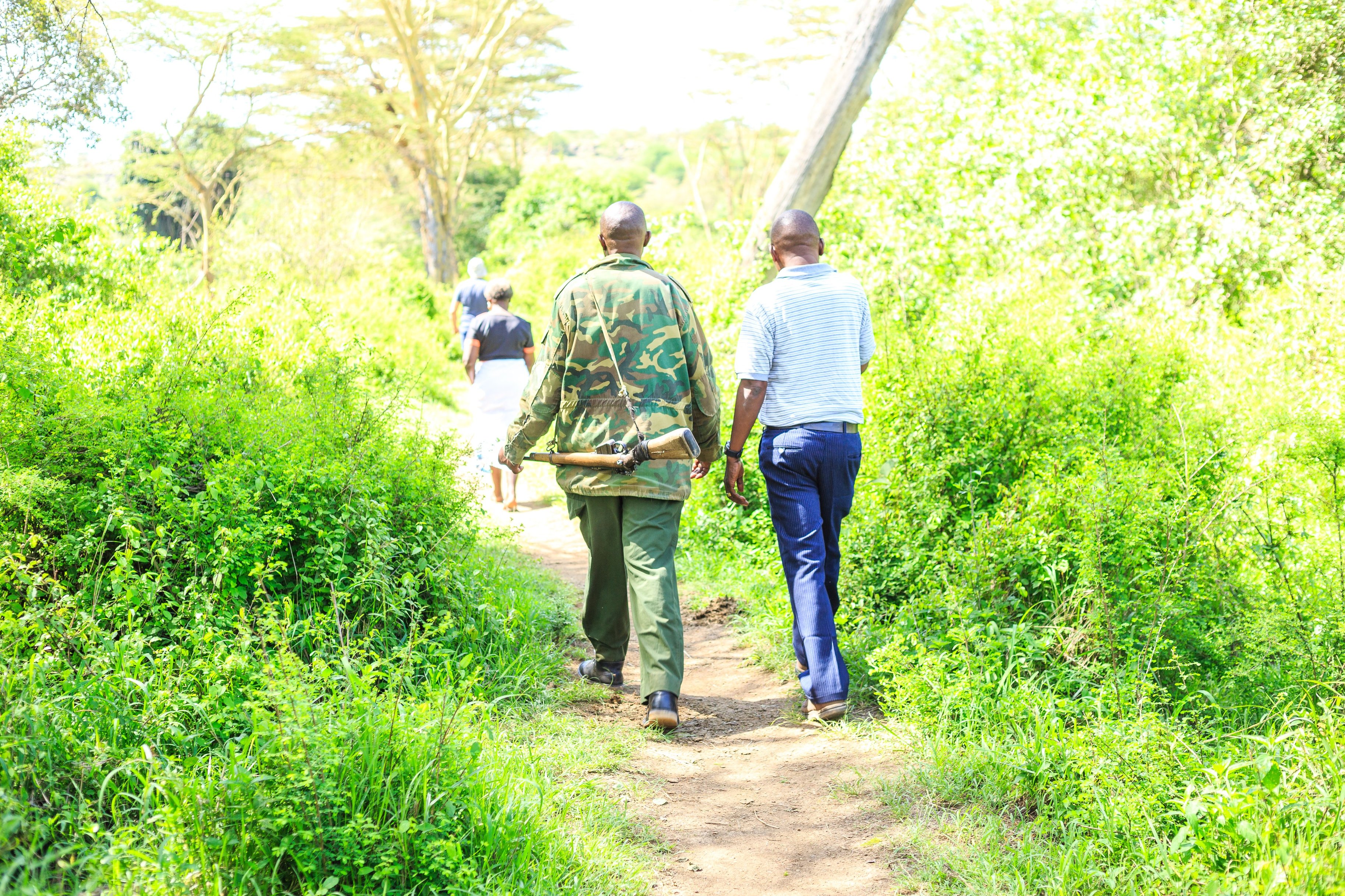 Ranger walking with tourists in Nairobi National Park, Kenya