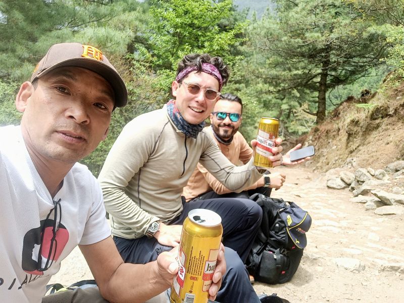Two trekkers and their Nepali guide on the Everest Base Camp trek route