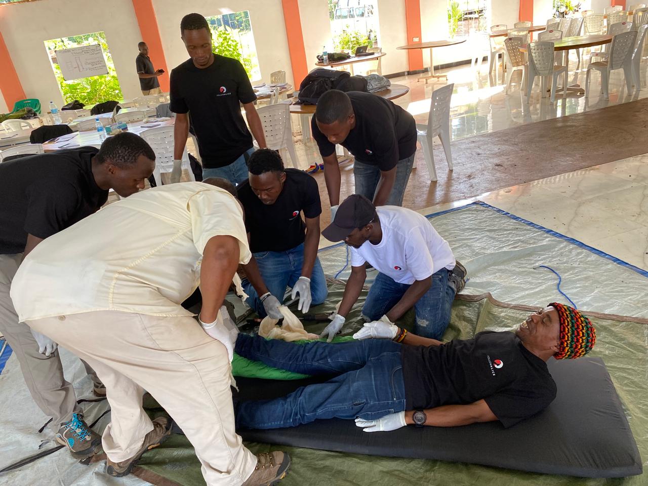 Kilimanjaro porters receiving first aid training, leg splint