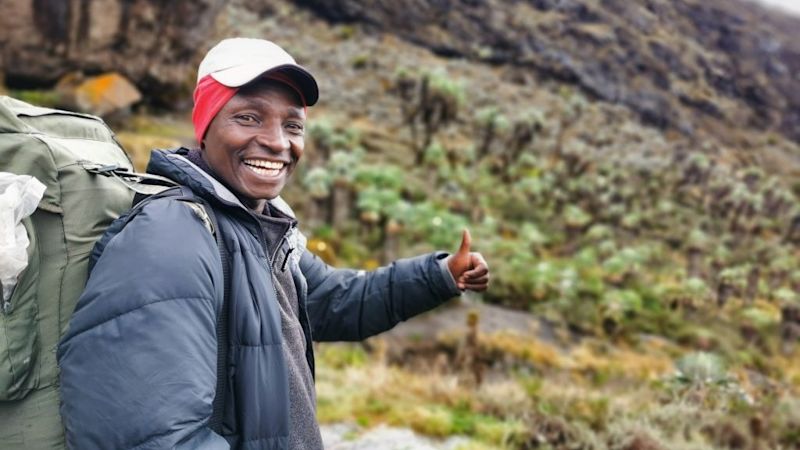 Florence smiling on Kilimanjaro in the heath zone