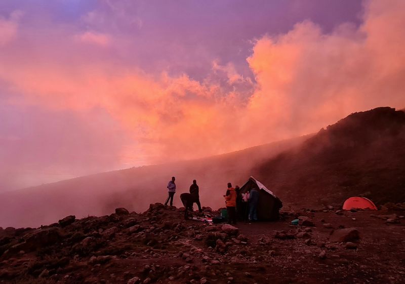 George K. Kilimanjaro. 8-day Lemosho. Campsite. Clouds, mist, tents, climbers