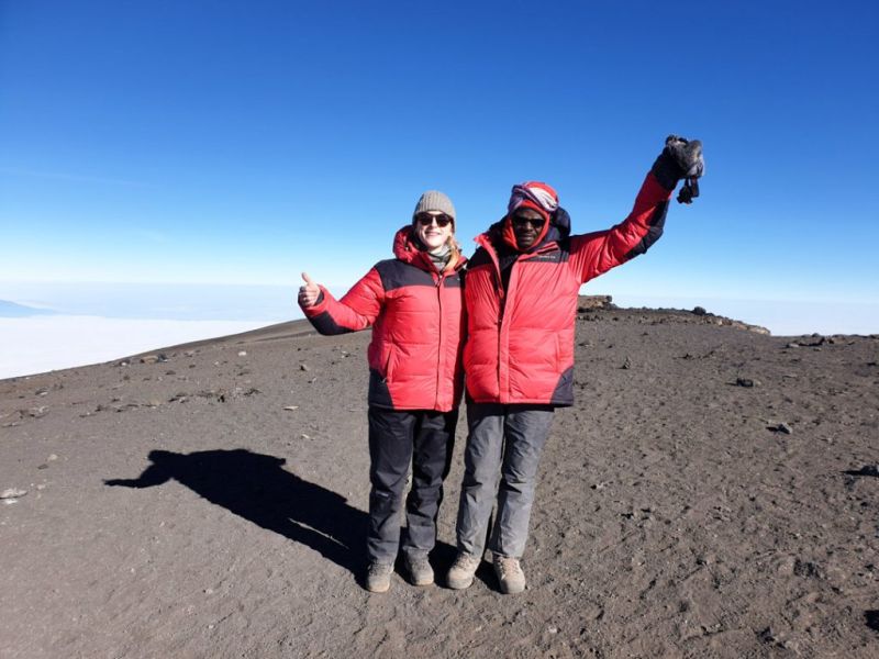Trekkers on the summit of Mt Kilimanjaro