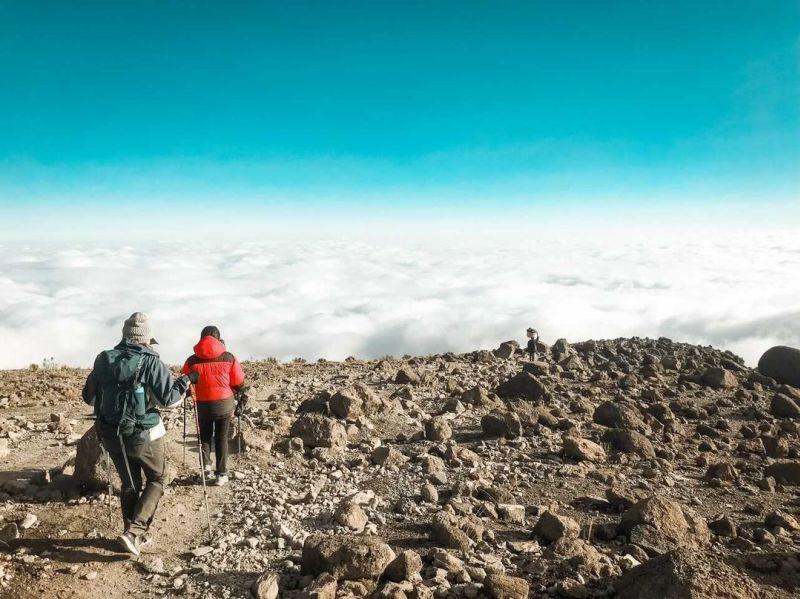 Kilimanjaro trekkers above the clouds