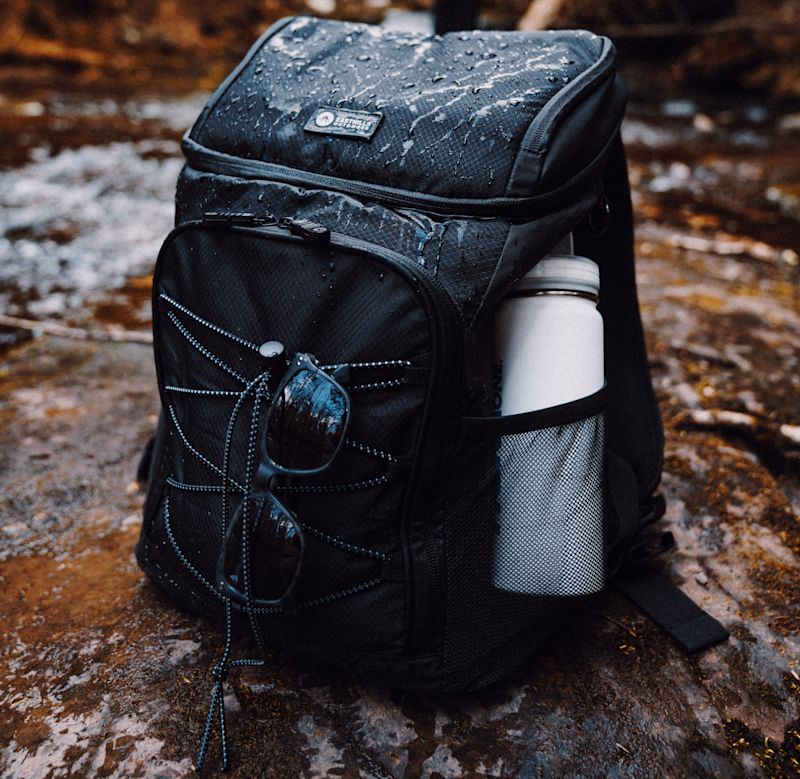 Backpack on the ground and rain droplets on it