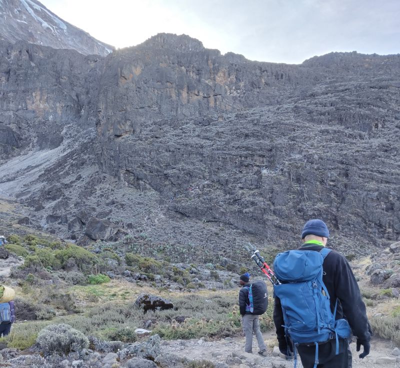Hikers walking towards Barranco Wall on Kilimanjaro