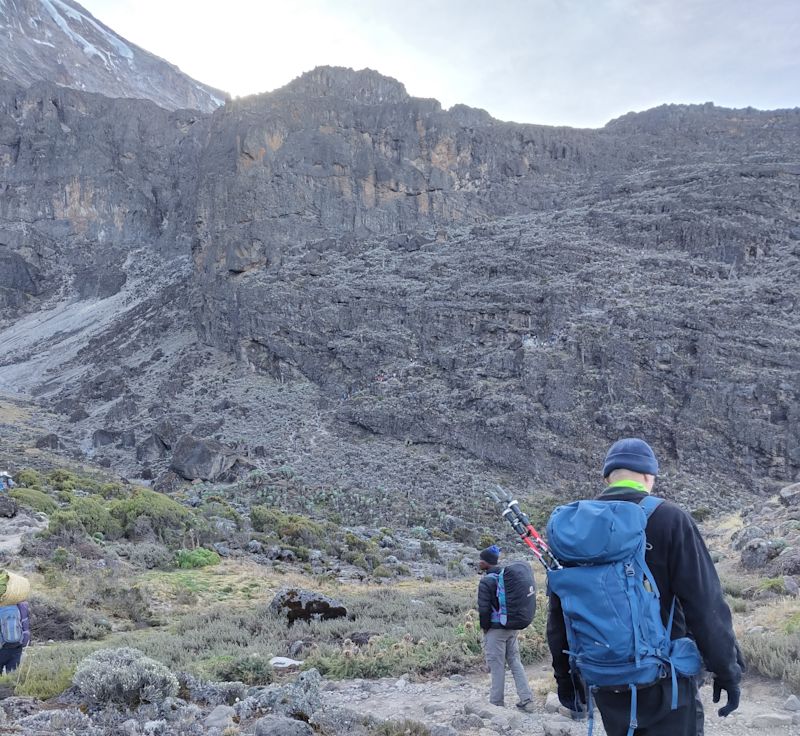 Hikers walking towards Barranco Wall on Kilimanjaro