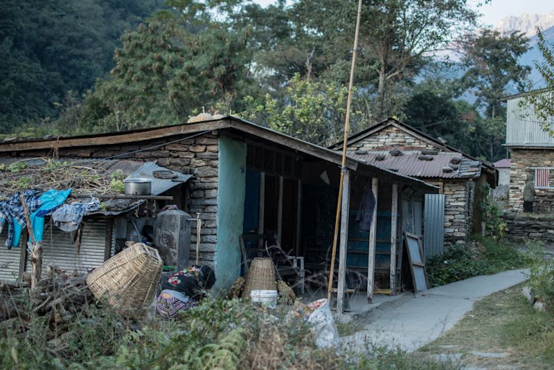 A local woman at work in village of Ngadi along the Annapurna Circuit route in Nepal