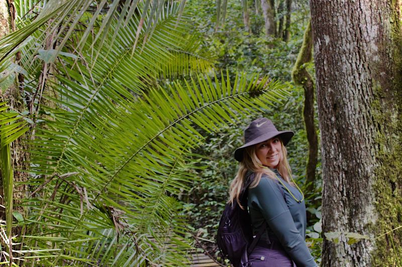 Woman on a chimp trek in the forest in Uganda
