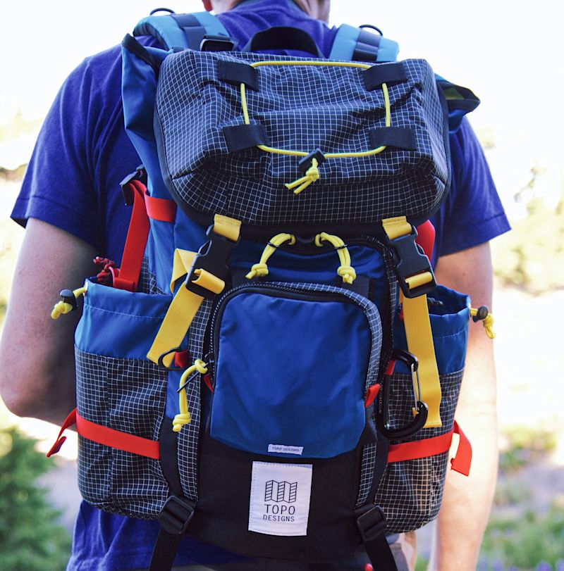 Multicoloured backpack with lots of straps and pockets