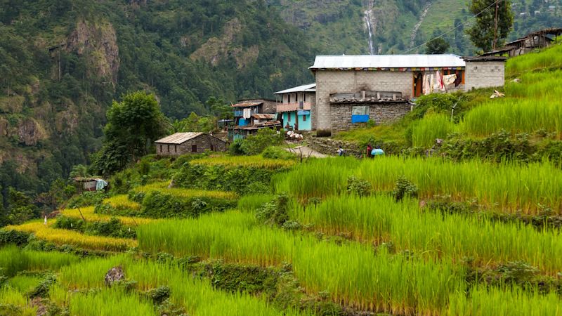 Beautiful landscape of Himalaya mountains on Manaslu circuit, terraced fields and village
