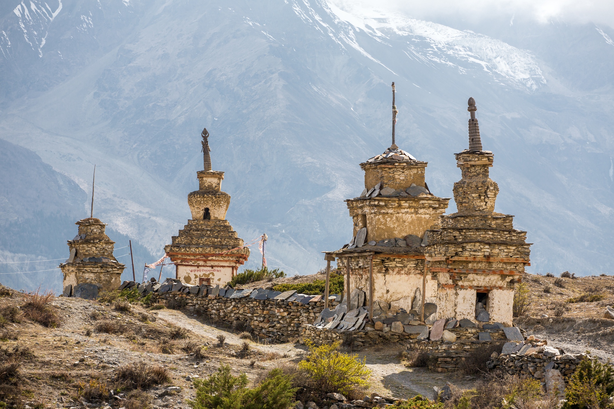 Traditional old Buddhist stupas on Annapurna Circuit Trek in Himalaya mountains, Nepal