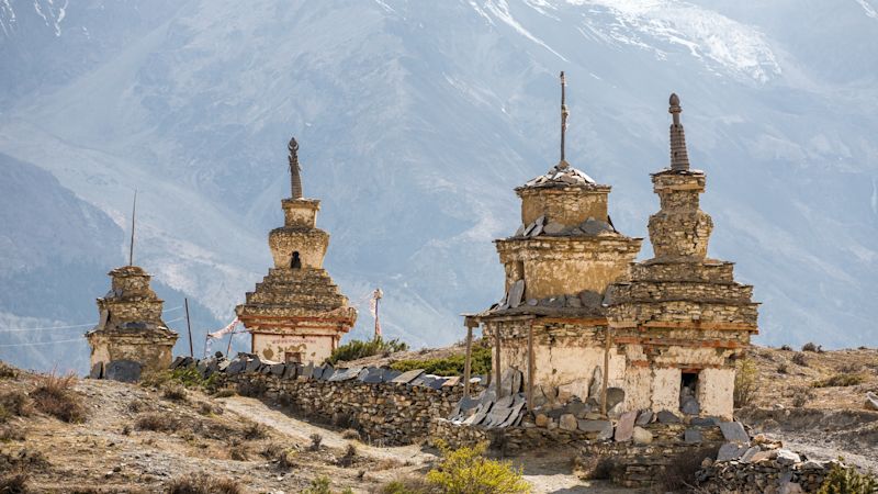 Traditional old Buddhist stupas on Annapurna Circuit Trek in Himalaya mountains, Nepal