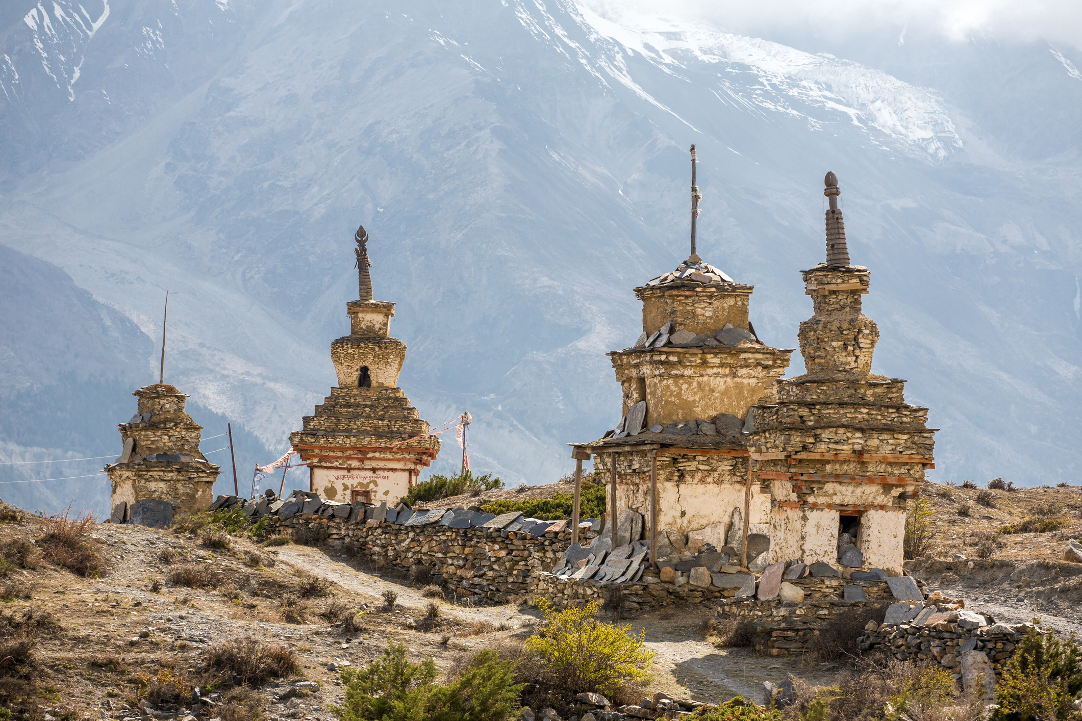Traditional old Buddhist stupas on Annapurna Circuit Trek in Himalaya mountains, Nepal