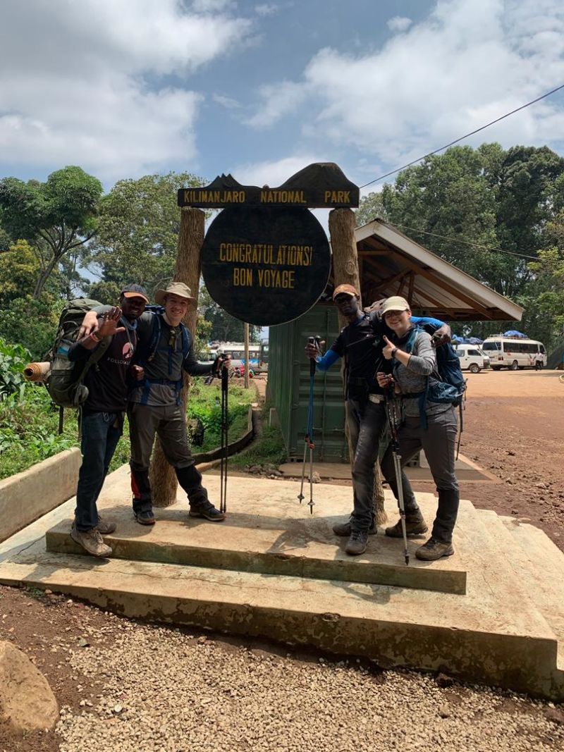 Kilimanjaro group photo at bon voyage sign