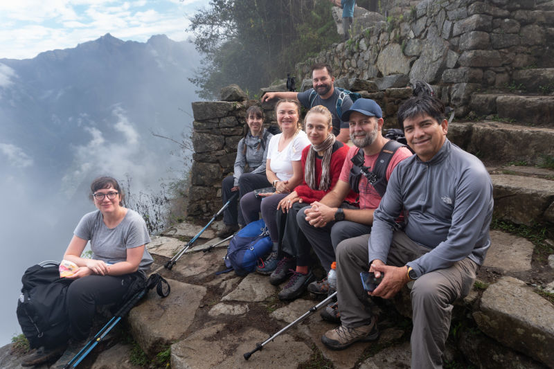 Trek group leader guide steps Inca Trail, Peru