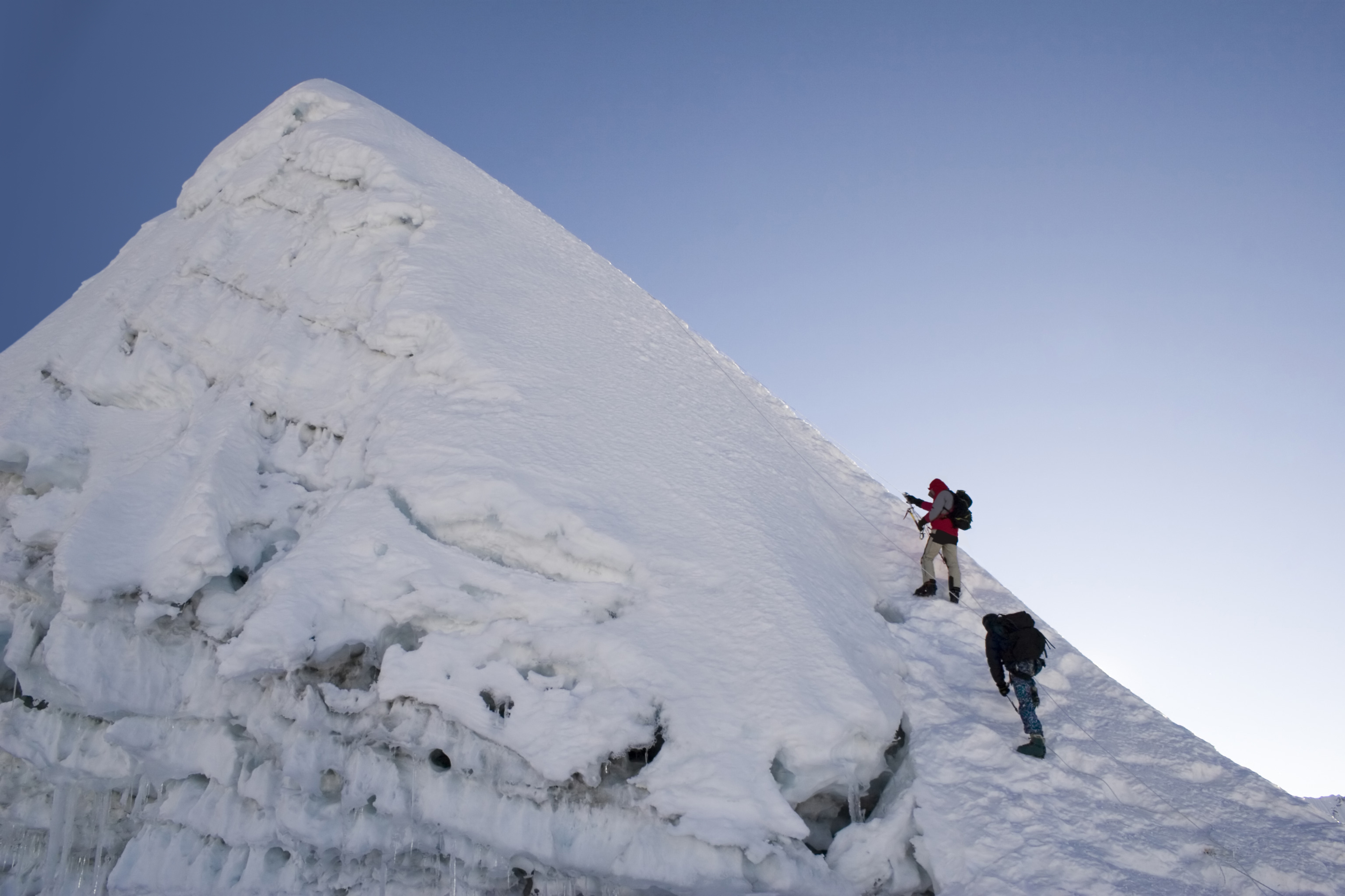 Two climbers are about to summit Island Peak in Nepal
