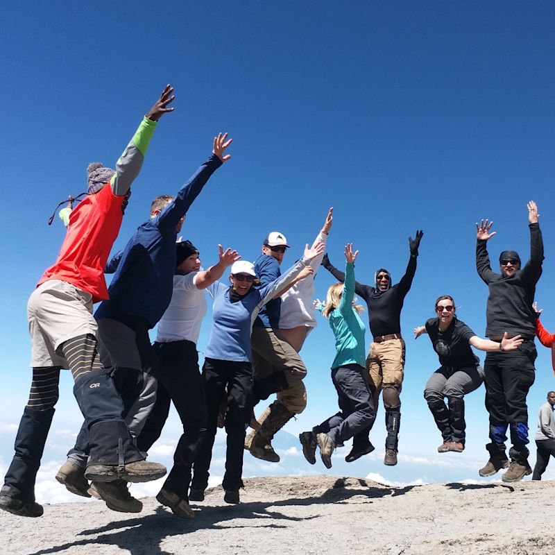Lucy group jumping on Mount Kilimanjaro