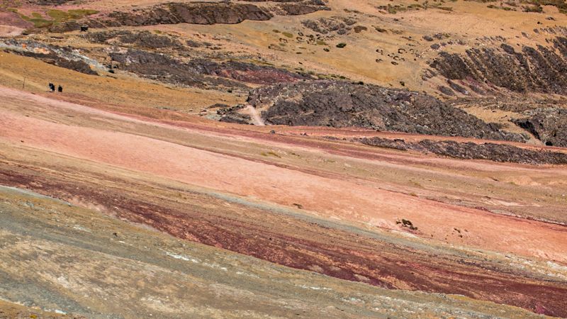 Close up multi-coloured soils on side of Rainbow Mountain, Peru