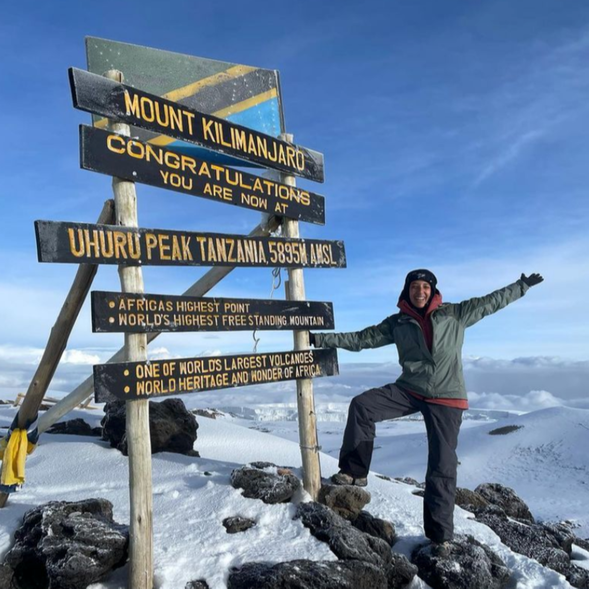 Happy climber at Uhuru sign