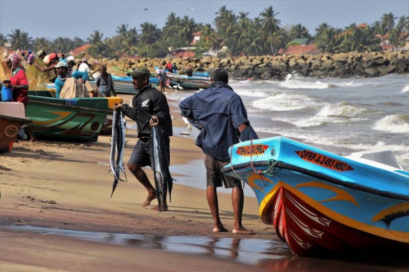 Fishermen on beach in Sri Lanka