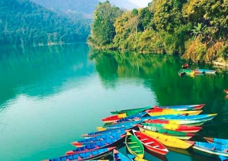 Pokhara's Lake Phewa with colourful canoes, Nepal
