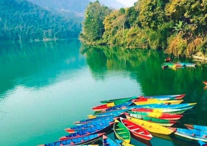 Pokhara's Lake Phewa with colourful canoes, Nepal