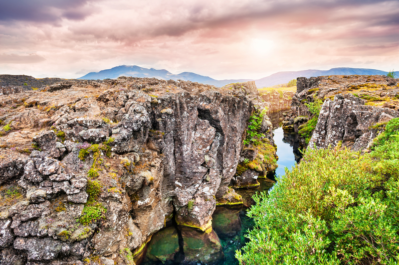 Cliffs and deep fissure in Thingvellir National Park, southern Iceland