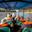 Boat full of people wearing red life jackets on Tambopata River heading to lodge in Peruvian Amazon rainforest/jungle
