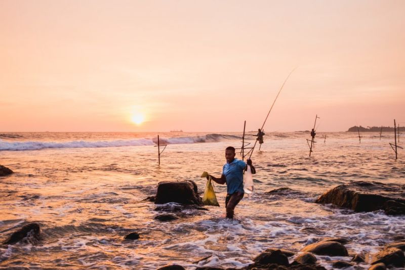 stilt fishermen at sunset