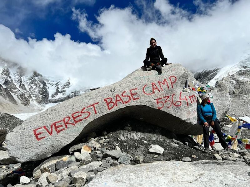 Woman sitting on large rock at Everest Base Camp