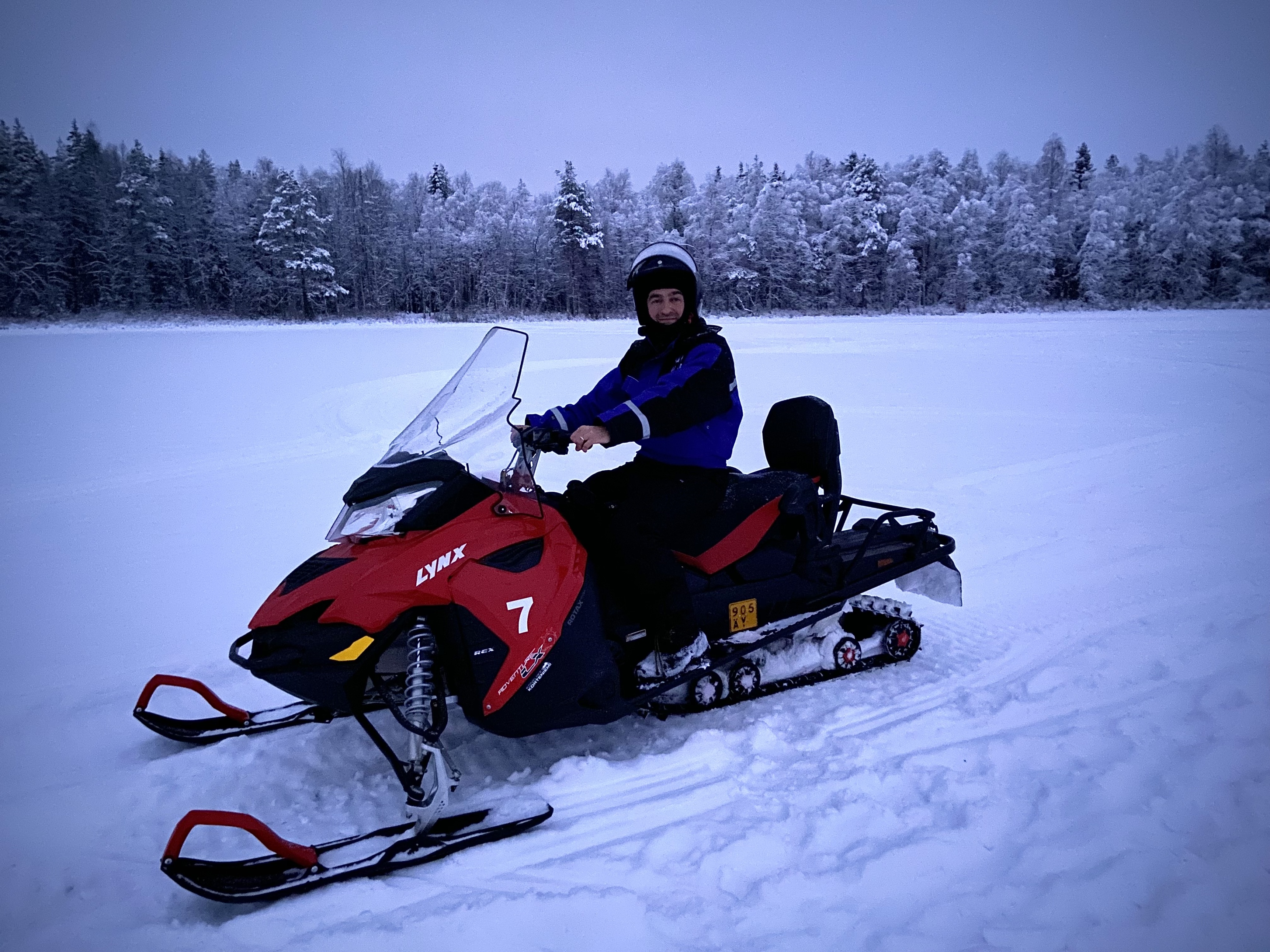 Man on snow mobile in snowy landscape