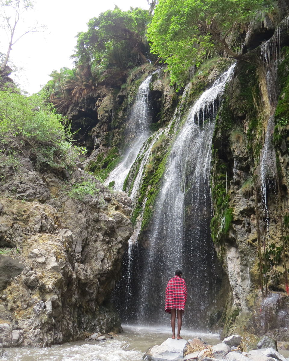 Megan. Samuel at Ngare Sero waterfall