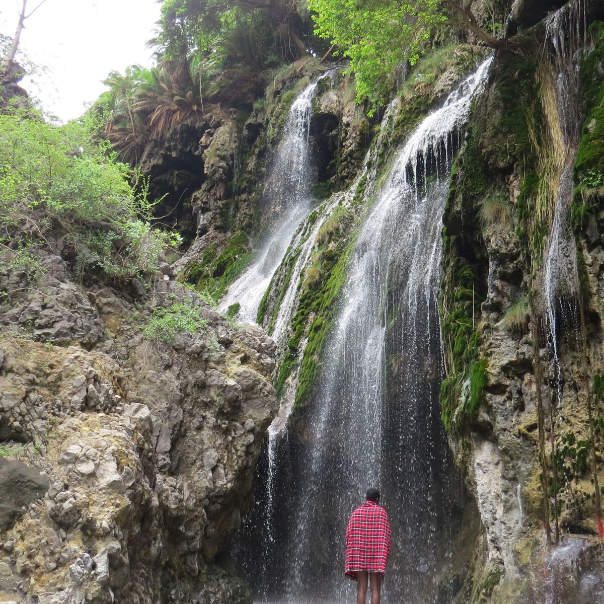 Megan. Samuel at Ngare Sero waterfall