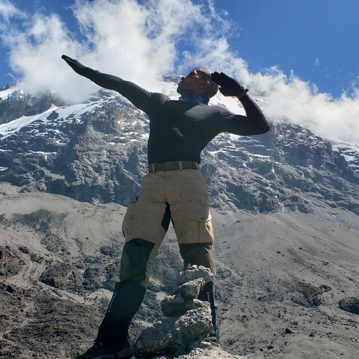 Lucy Lofton group hero pose Kilimanjaro