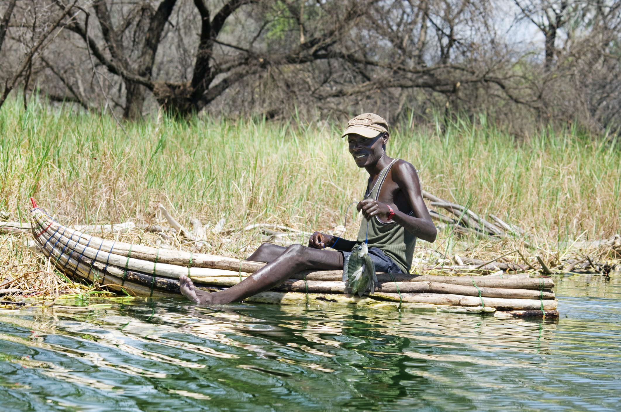 Fisherman catches a fish January 8, 2013 at Lake Baringo, Kenya.
