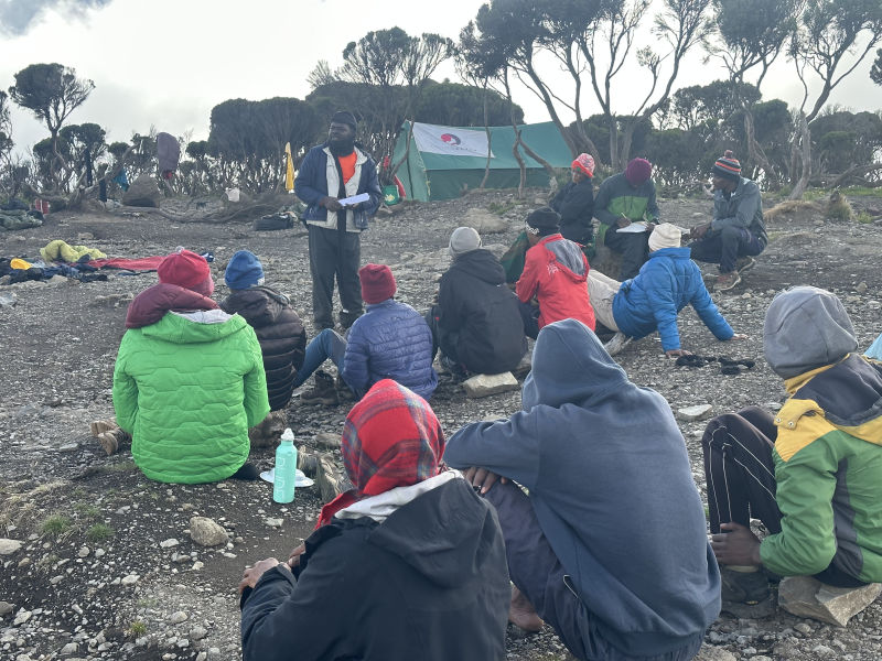 FA Kilimanjaro crew seated at camp