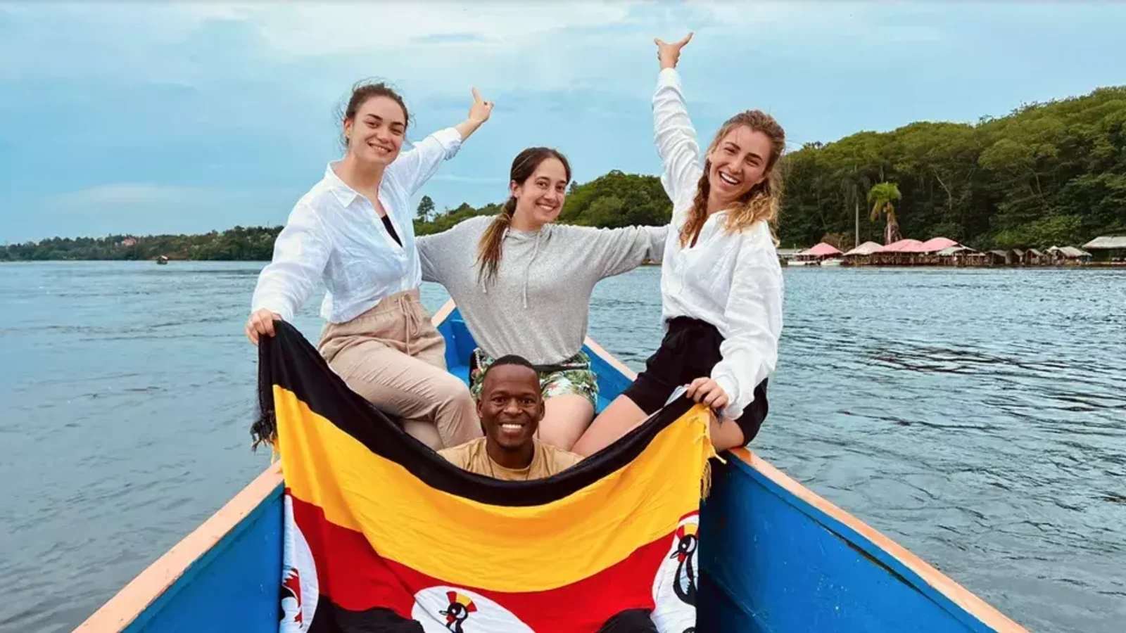 Gary Simon in boat with clients, Uganda