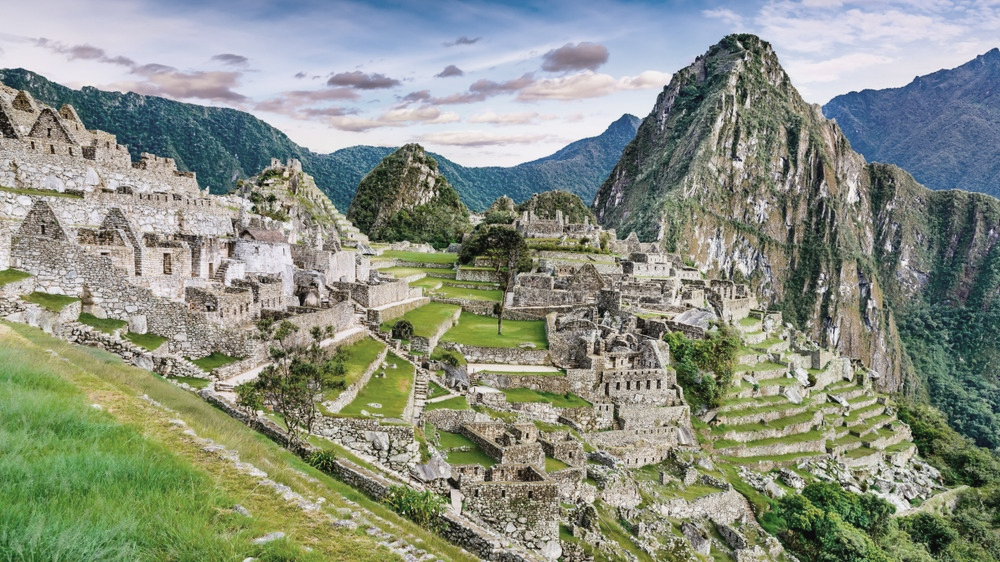 Machu Picchu in Peru - Ruins of Inca Empire city and Huaynapicchu Mountain in Sacred Valley, Cusco